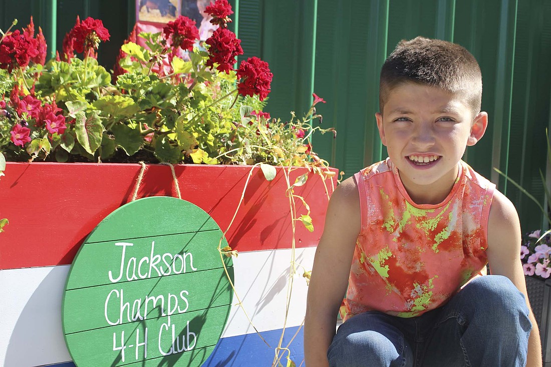 Kyler Morehouse, a seventh grader, participates in a long list of 4-H projects. Many of them involve his produce after he took over the family garden about 5 years ago. (The Commercial Review/Bailey Cline)