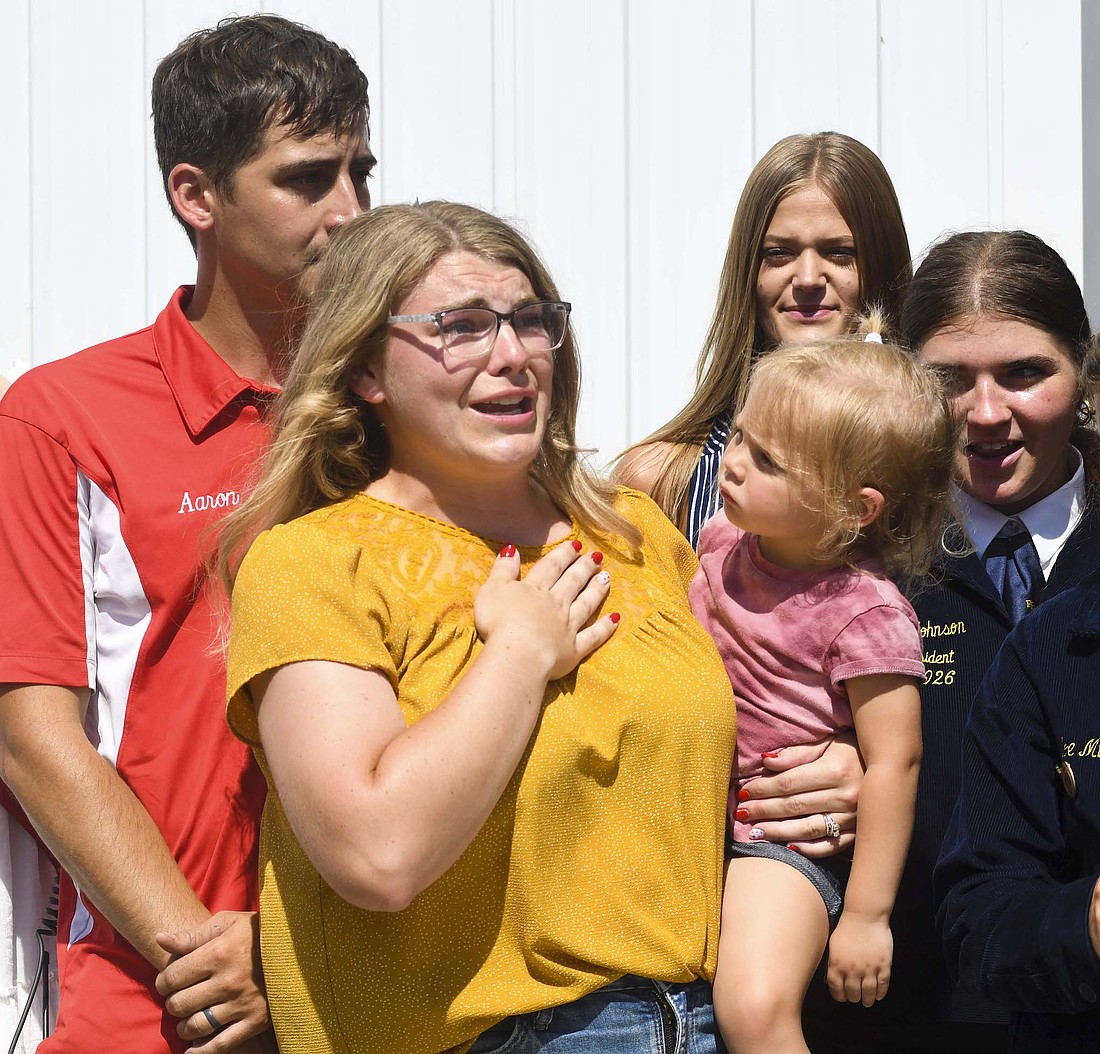 Jay County FFA advisor Katie Loy speaks Monday during a ribbon-cutting ceremony for the new Robert C. and Joyce A. Lyons FFA Pavilion at Jay County Fairgrounds. (The Commercial Review/Ray Cooney)
