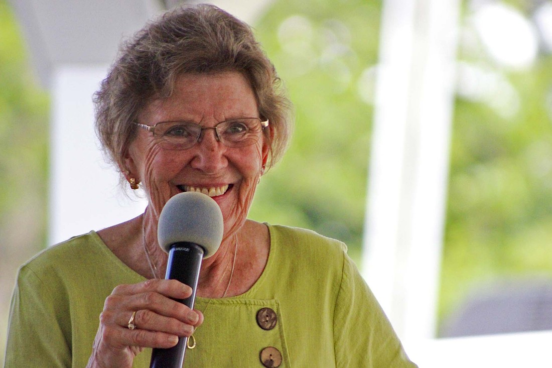 Becky Matchett grins after teasing her husband amid speaking about her community efforts Wednesday during the Jay County Hall of Fame ceremony at the Farmer’s Building. She was one of seven honorees to be recognized during the event at the Jay County Fair. (The Commercial Review/Bailey Cline)