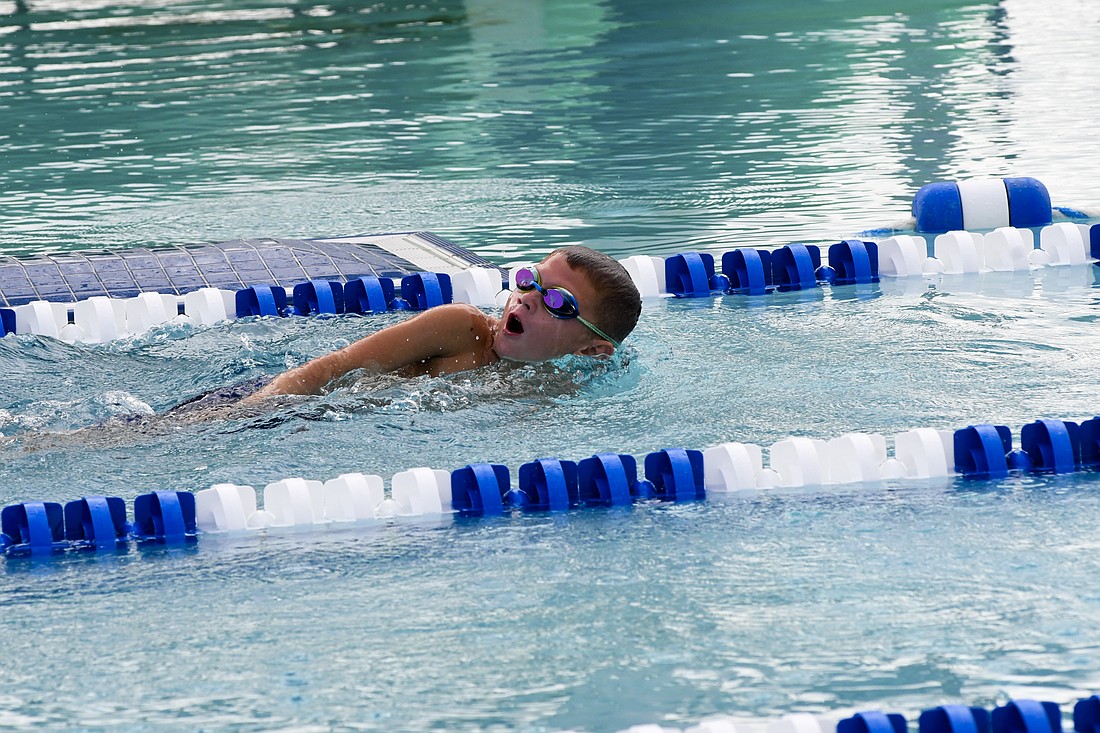 Tucker Loucks swims the freestyle leg of the 8-and-younger 100-meter medley relay for the Jay County Summer Swim team on Monday. Jay County beat up on Yorktown 724-216 to finish the regular season 7-0. (The Commercial Review/Andrew Balko)