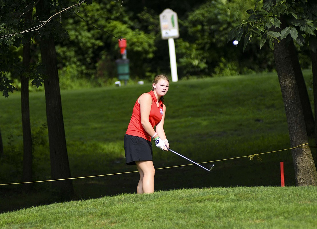 Alexa Ridenour chips onto the 15th green at Wabash Valley Golf Club on Monday morning during the South Adams Invite. The Patriots kick off the 2025 season in the tournament with one returner, one first-year golfer and three freshmen, including Ridenour. (The Commercial Review/Andrew Balko)