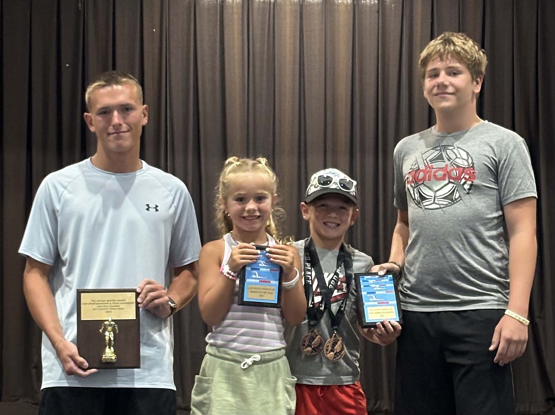The Jay County Summer Swim team handed out postseason awards following an undefeated regular season. Lincoln Clamme (far left) won the Jacqui Baxter Sportsmanship and Team Leadership Award. Next in line is Grace Sieg, who won the Rookie of the Year Award. Jay County named both Tucker Loucks and Josh Bennett (far right) recipients of the Most Improved Swimmer Award. (Photo provided)