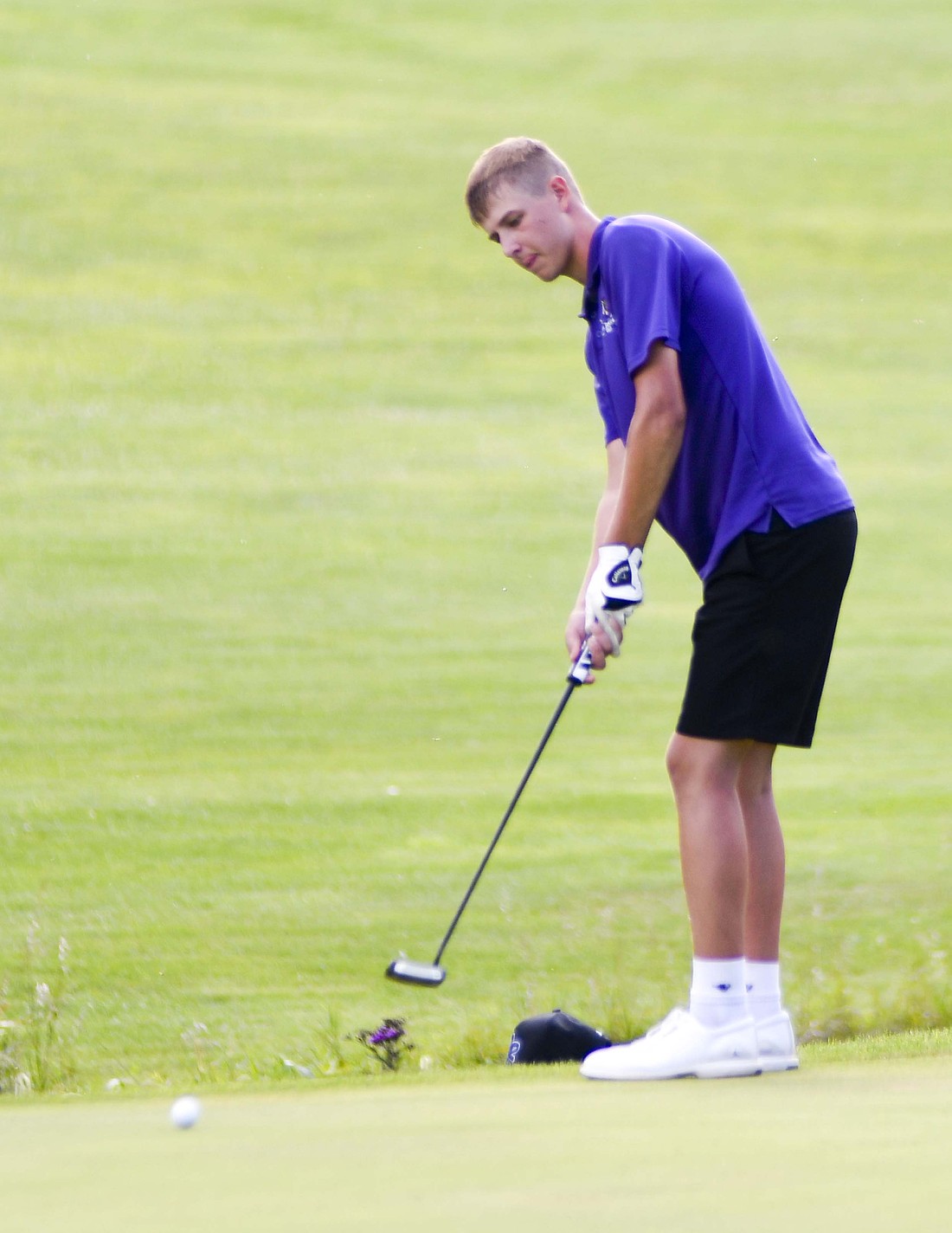 Garrett Diller of the Fort Recovery High School boys golf team putts on the 13th green at Portland Golf Club during his 49-stroke round on Thursday. The Tribe beat New Bremen 179-193 to pick up their first Midwest Athletic Conference win before facing Marion Local on Monday. (The Commercial Review/Ethan Oskroba)