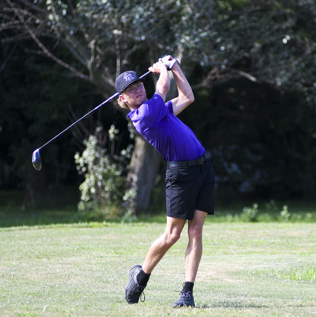 Caleb Smith of the Fort Recovery High School boys golf team tees off on the 14th hole at Portland Golf Club. Smith carded a 44 for the Tribe’s second-best score in the 172-177 victory over Marion Local on Monday. (The Commercial Review/Andrew Balko)