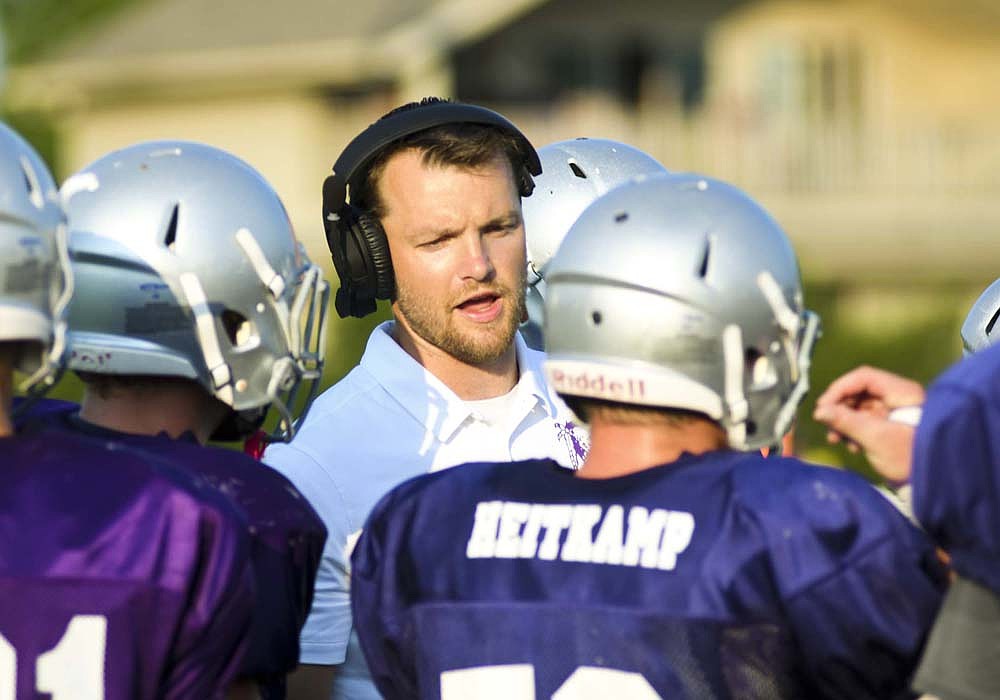 First year Fort Recovery High School football coach Wes Wenning talks to his players Friday night during their scrimmage against Indian Lake at Barrenbrugge Athletic Park. The Indians will open their season at home Friday, Aug. 22, against Ponitz Career Tech. (The Commercial Review/Ray Cooney)