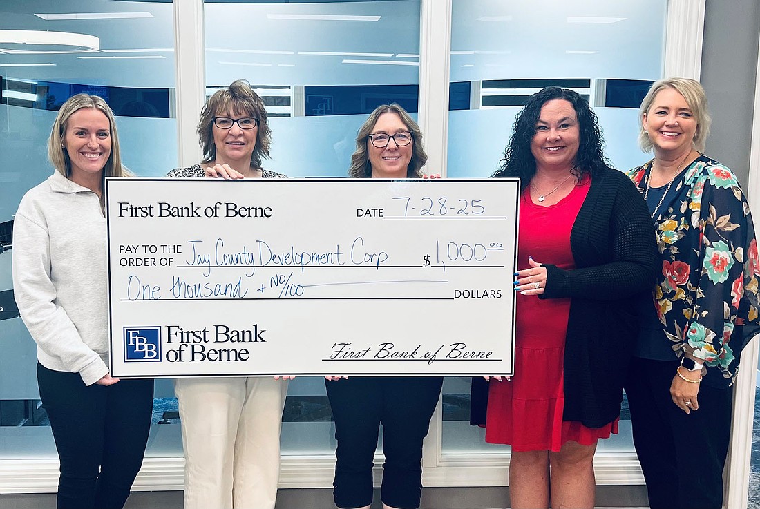 First Bank of Berne recently donated $1,000 to Jay County Development Corporation. Pictured, from left, are mortgage loan originator Tanner McClain, Ceann Bales and Jodi Hayes of JCDC, agribusiness banker Angela Paxson and First Bank of Berne Portland branch manager Tracy Carpenter. Paxson is also president of the JCDC board of directors. (Photo provided)