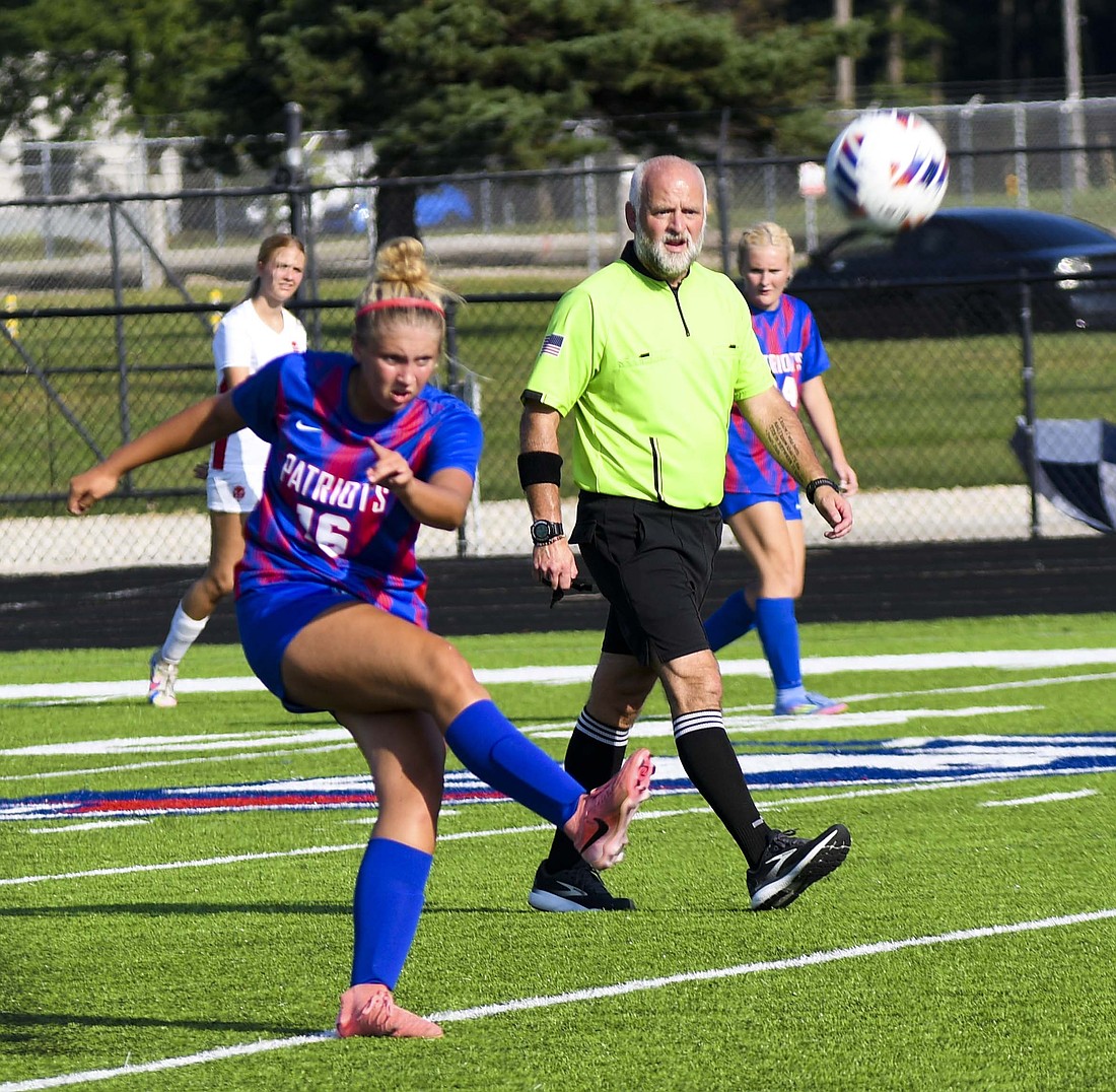 Sophomore midfielder Raylin Hummer blasts a long ball during the Jay County High School girls soccer team’s home clash with Richmond on Monday. Hummer failed to tap in a close-range opportunity in the final seconds of the first half, but broke through with a second half goal in the Patriots’ 4-0 win. (The Commercial Review/Andrew Balko)