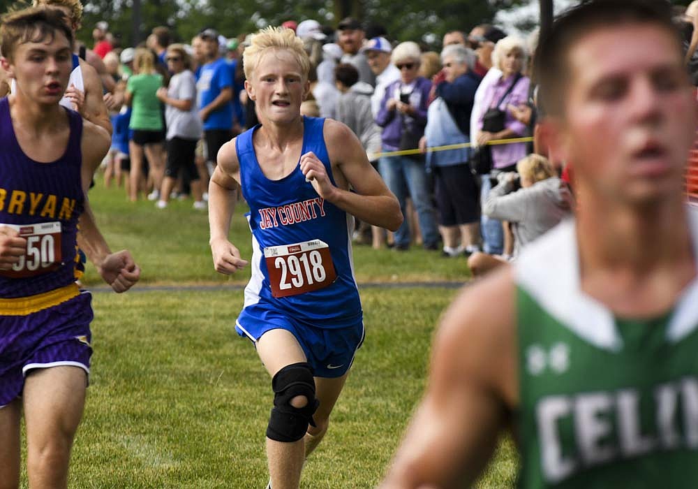 Caison Lloyd of the Jay County High School boys cross country team runs near the finish line during Saturday's Celina Rotary Invitational at Wright State University Lake Campus. The Patriot teams finished fourth (girls) and seventh (boys) in the meet. Lloyd was 48th in 19:38.6. (The Commercial Review/Ethan Oskroba)
