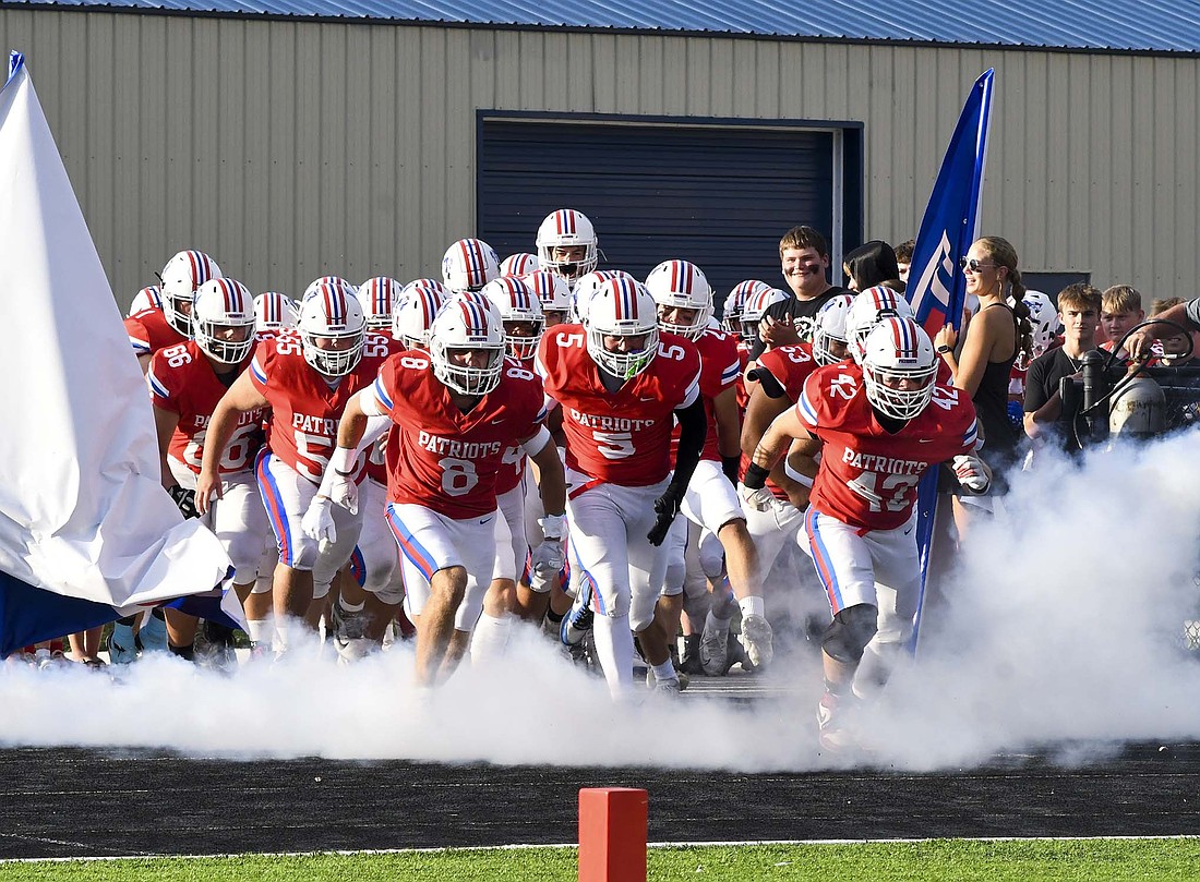 The Jay County High School football team charges onto the field for the first time in the 2025 season Friday night for their game against the Blackford Bruins. The Patriots scored the game’s first 23 points and rolled to a 56-6 victory. They will have an extra day to prepare for the first road game as they will visit New Castle at 1 p.m. Saturday. (The Commercial Review/Andrew Balko)