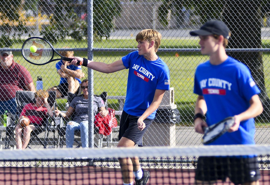 Brock Wasson, a No. 2 doubles player on the Jay County High School boys tennis team, hits a forehand during Monday’s 5-0 sweep of the Union City Indians. Wasson and Gabe Overton swept Joseangel Perez-Contreras and Asa Vaughn 6-0, 6-0 to pick up their third win of the season. (The Commercial Review/Andrew Balko)