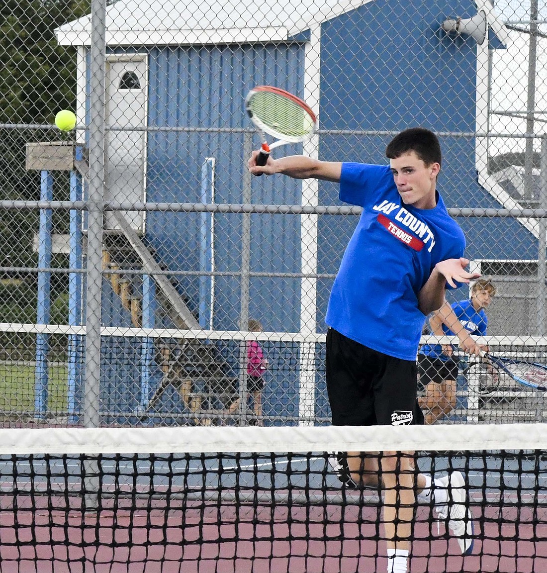 Alex Miller follows through on a volley during the Jay County High School boys tennis team’s 5-0 sweep of Union City on Monday. Miller patrolled the net, while Kadyn Carpenter controlled the back line as the No. 1 doubles duo beat Gabe Tapps and Cooper Woolston 6-1, 6-0. (The Commercial Review/Andrew Balko)