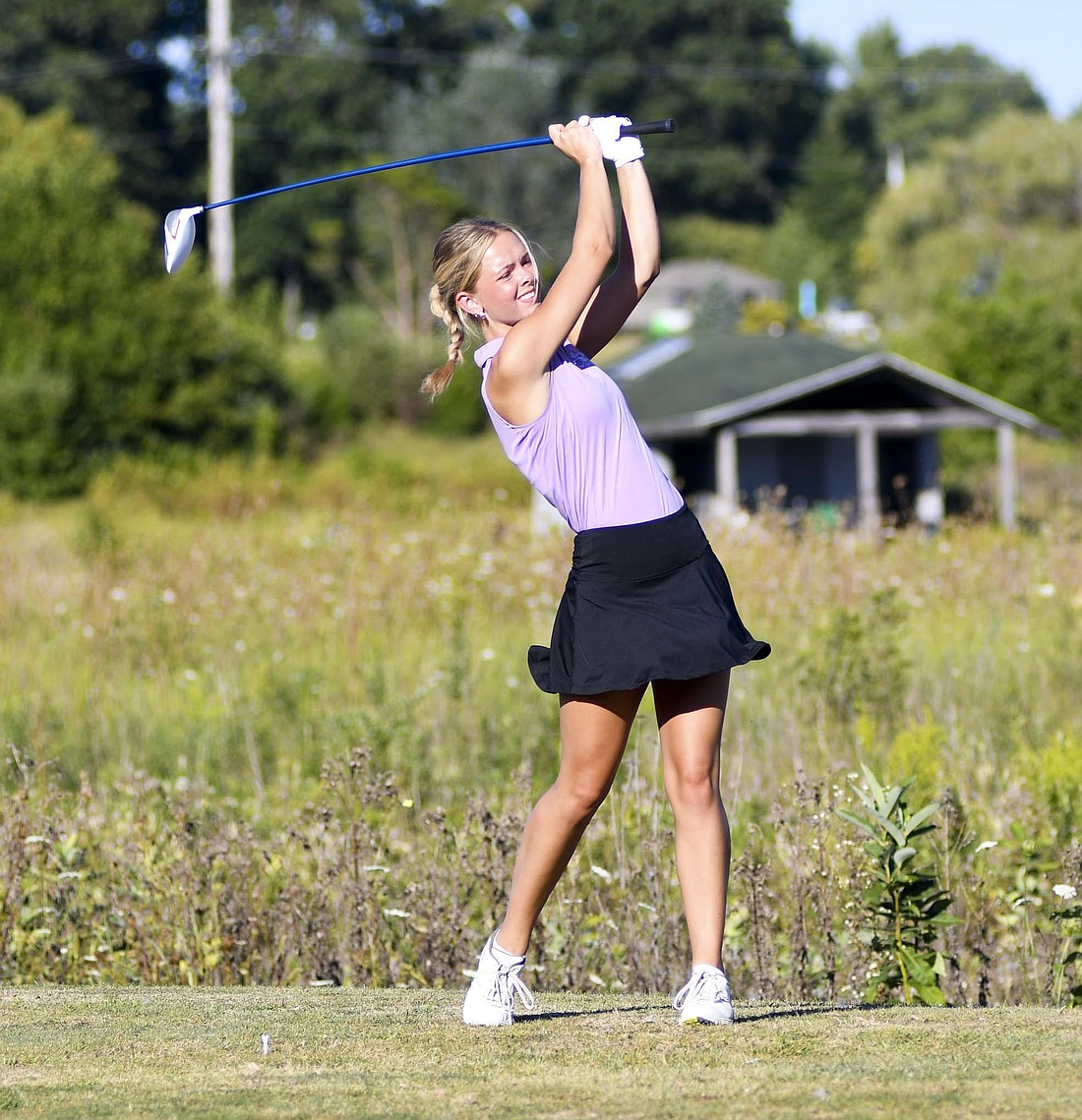 Fort Recovery High School senior Georgia Wenning follows through on her drive hole No. 5 at Portland Golf Club on Tuesday. Wenning shot a 48 to help lead the Tribe past Jay County and Winchester. (The Commercial Review/Andrew Balko)