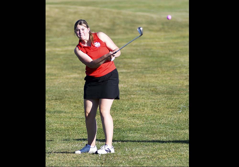 Reny Lingo of the Jay County High School girls golf team hits an approach shot during Tuesday’s match against Fort Recovery and Winchester. The Patriots picked up their second win of the season as they shot a 220 and Winchester had a 232. FRHS won the meet with a 185. (The Commercial Review/Andrew Balko)