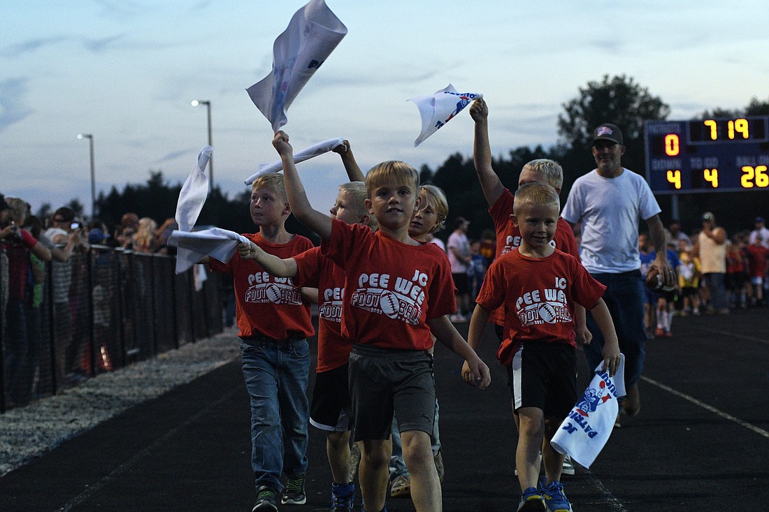 Jay County High School celebrated the youth of the community during halftime of Friday night’s football game against Adams Central, with children who took part in this week’s cheerleading clinic joining the varsity cheerleaders on the track for a cheer and the Jay County Pee Wee Football teams being introduced. Pictured above, Addison Hurt grins while participating in the halftime cheer. (The Commercial Review/Ray Cooney)