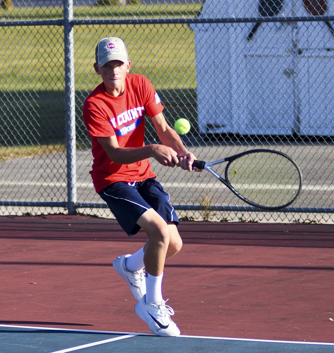 Henry Dirksen hits a backhand during the Jay County High School boys tennis No. 2 singles match against Blackford on Monday. Dirksen beat Owen Norton 6-4, 6-4 to help the Patriots win the match 4-1. (The Commercial Review/Andrew Balko)