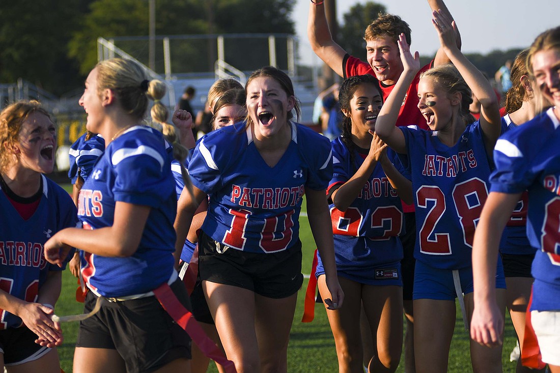 Jay County High School seniors (from left) Emma Hatzell, Paisley Fugiett, Alexis Sibray, Aixa Lopez, Nick Laux and Paityn Wendel celebrate after their powderpuff victory over the freshmen in the semifinal game. The Class of 2026 went on to defeat the juniors in the championship game. (The Commercial Review/Ray Cooney)