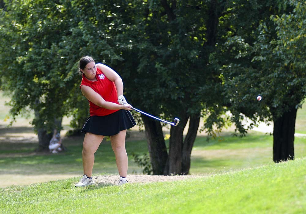 Jay County High School junior Erin Aker chips onto the eighth green Saturday during the girls golf sectional tournament at Crestview Golf Club in Muncie. She shot a career-best 94, coming up just three strokes short of a regional berth. (The Commercial Review/Ray Cooney)