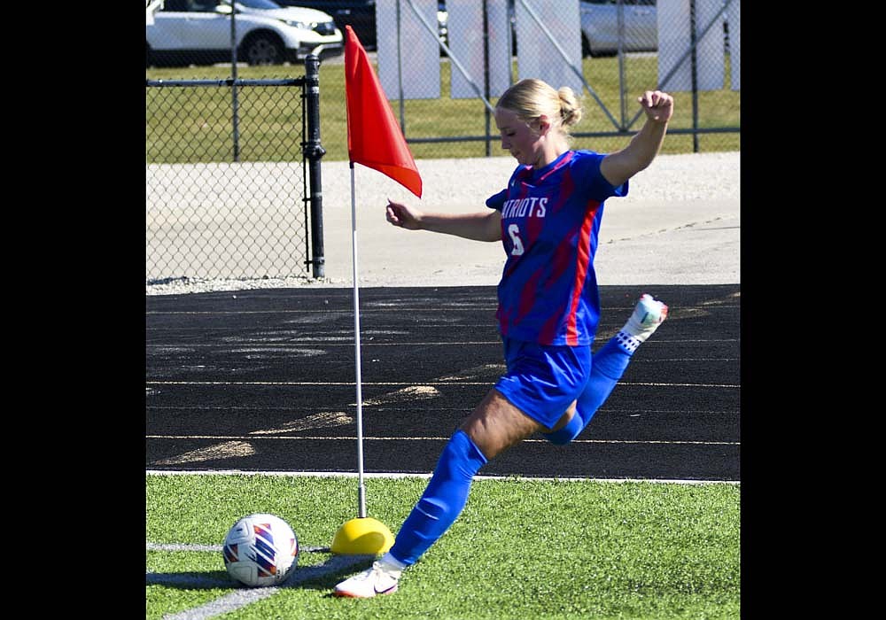 Tessa Frazee comes through for a corner kick during the Jay County High School girls soccer team’s 4-0 win over Heritage on Saturday that locked up a perfect record in the Allen County Athletic Conference. Frazee, a defender for the Patriots, had two assists off of corner kicks, the first to London Lloyd and the second, which is pictured, went to Aixa Lopez. (The Commercial Review/Andrew Balko)