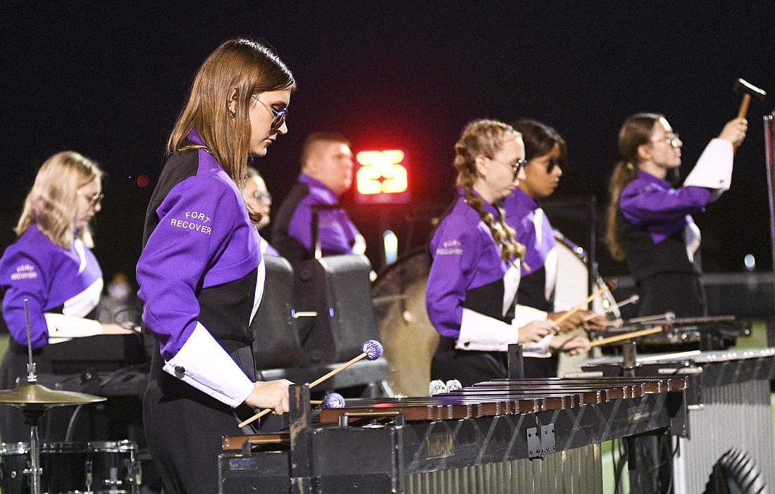 Members of the percussion section (from left) Alivia Grube, Megan Weitzel and Yoselin Juarez-Gomez perform during halftime of Friday night’s homecoming football game against New Bremen. The next competition for the band is slated for Saturday at Versailles. Fort Recovery will perform at 5:15 p.m. (The Commercial Review/Ray Cooney)