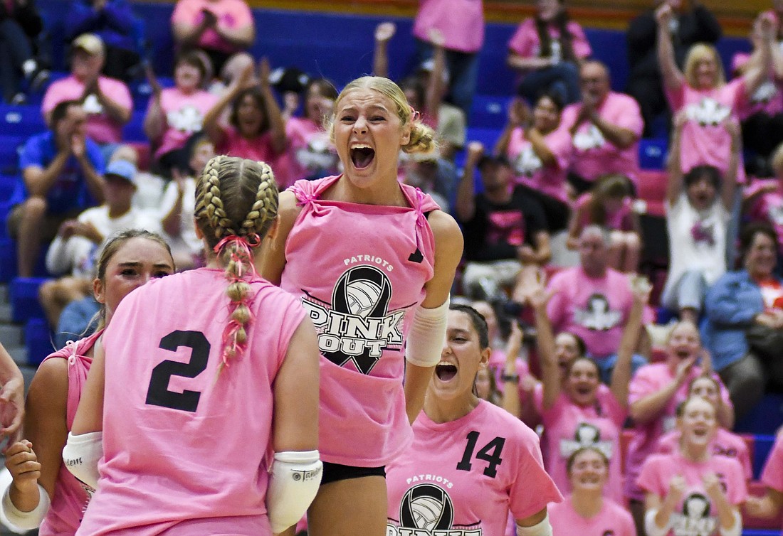 Jay County High School volleyball team secured the outright Allen County Athletic Conference regular-season volleyball championship with a win over Class 3A No. 7 Heritage while the boys tennis team defeated Randolph Southern to earn its fourth consecutive sectional title. Pictured above, JCHS junior Hallie Schwieterman screams at Elizabeth Barnett (2) after rallying in the fourth set of the ACAC clincher. Schwieterman led JCHS with 19 kills while Barnett added 12. (The Commercial Review/Andrew Balko)