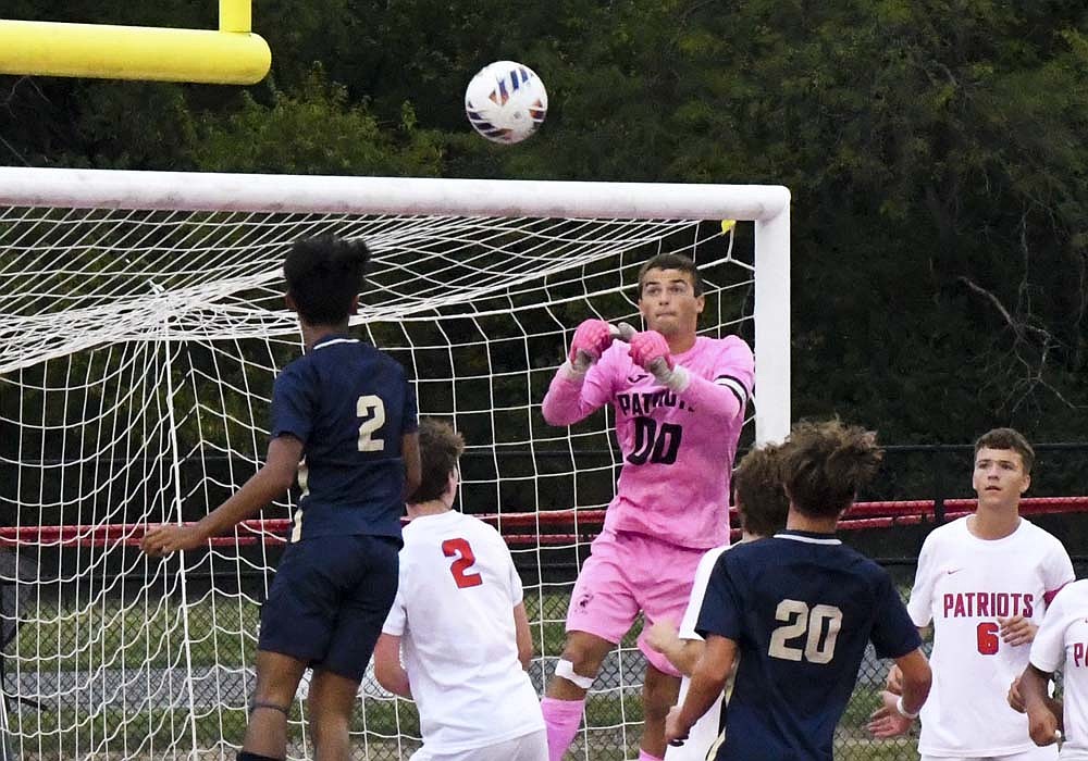 Peyton Yowell of the Jay County High School boys soccer team rises up to clear a cross during the Patriots’ 1-0 loss to the Oak Hill Golden Eagles in the quarterfinals of the Mississinewa Sectional on Tuesday. Yowell is one of three Patriots who will not return to the team next season, along with fellow senior Max Klopfenstein and foreign exchange student Elias Mueller. (The Commercial Review/Ethan Oskroba)