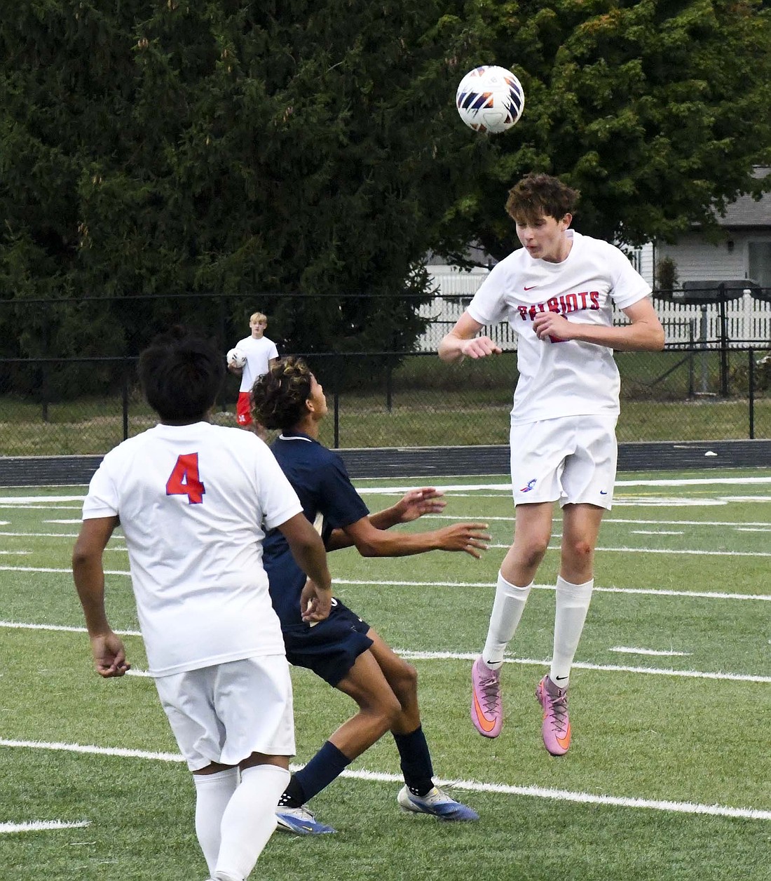 Jay County’s Brody Collins heads a ball during the Patriots’ 1-0 sectional quarterfinal loss to Oak Hill on Tuesday. Collins scored eight times for the Patriots this season, combining with fellow freshman Jacoby Penrod to account for 56% of Jay County’s goals. (The Commercial Review/Ethan Oskroba)