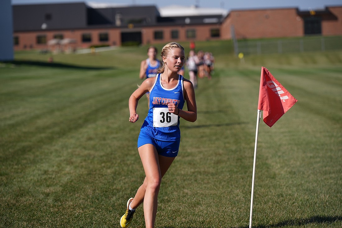 Jay County High School senior Paityn Wendel makes a turn during the Allen County Athletic Conference cross country championship hosted by South Adams on Saturday. Wendel placed eighth with a time of 22 minutes, 11.3 seconds to help the Patriots claim the ACAC title. (Special to The Commercial Review/Paul Yoder)
