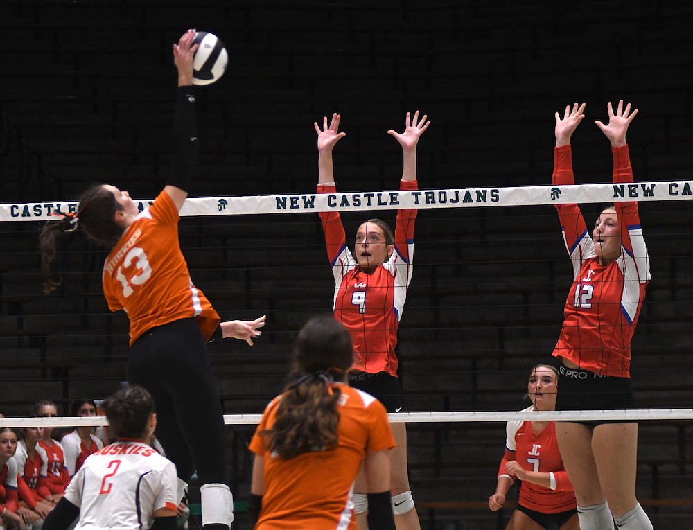 Maria Hemmelgarn (right) and Brenna Schmiesing rise up to attempt a block during the Jay County High School volleyball team’s 25-20, 25-14, 25-20 loss to the Hamilton Heights Huskies in the championship match of the IHSAA Class 3A Sectional 24 tournament at New Castle on Saturday. Hemmelgarn’s three solo blocks and four total stuffs led a Patriot defense that only mustered five blocks in the three-set loss. (Ethan Oskroba/The Commercial Review)