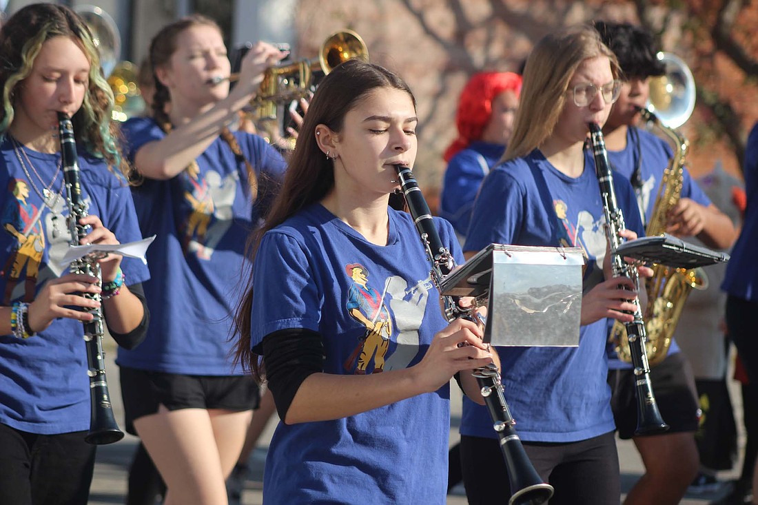 Jay County Marching Patriots band members march along Union Street (Indiana 1) in Pennville on Saturday during the Pumpkin Festival parade. The parade led into a day of activities, food, pumpkins and other festivities at Pennville Park. (The Commercial Review/Bailey Cline)