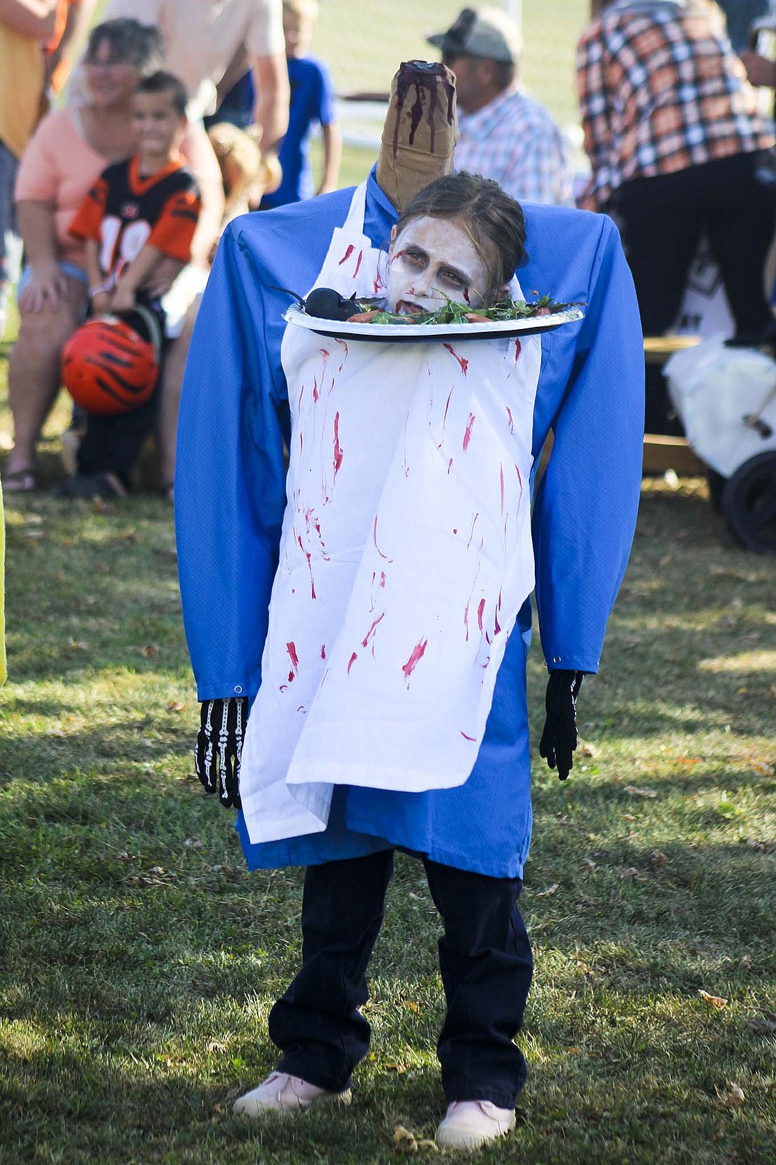 Emma Huffman, 8, Montpelier, participates in the costume contest Saturday at the Pennville Pumpkin Festival. The event included a 5K race, a parade, vendors, a car show and a skillet-throwing contest. (The Commercial Review/Bailey Cline)