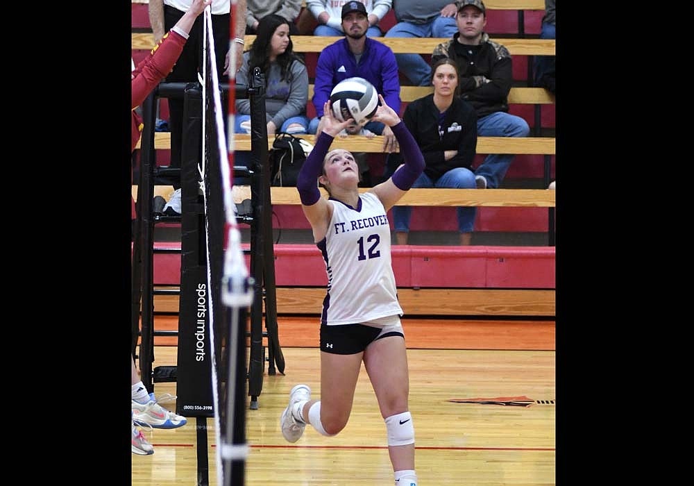 Hailey Easton of the Fort Recovery High School volleyball team sets a ball during the OHSAA Division VI Southwest 3 District semifinal against Northeastern on Tuesday. Easton stepped up and tallied 29 assists in place of starting setter Kayden Ranly, who missed the game with a swollen knee. (The Commercial Review/Andrew Balko)