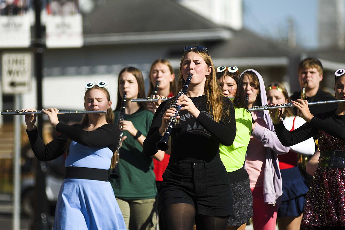 The Fort Recovery High School marching band, led by drum major Elisa Evers, performs in the village’s Halloween parade on Sunday. The parade ran from the high school to Van Trees Park, where there was a costume contest. (The Commercial Review/Ray Cooney)