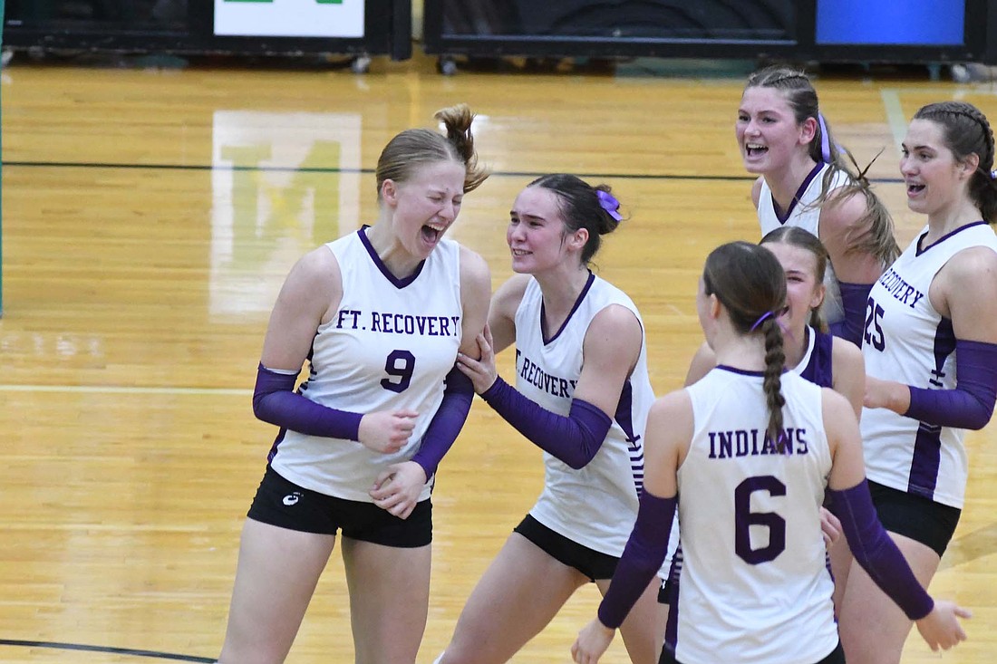 Brynn Willmann (9) of the Fort Recovery High School volleyball team lets out a scream while her teammates rush to celebrate after blocking an attack by Arcanum during the OHSAA Division VI Regional 24 semifinal hosted by Northmont on Wednesday. Willmann led the Tribe with 13 kills and five blocks as it clinched its third regional final berth with a 25-20, 21-25, 25-21, 26-24 victory over the top-seeded Trojans. (The Commercial Review/Andrew Balko)