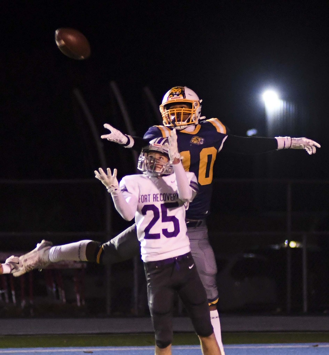 Fort Recovery High School’s Ian McCain positions himself to intercept a pass intended for Sir Michael Miller of Cincinnati College Prep in the regional opener. The Tribe will take on fourth-seeded Eastern tonight in the quarterfinal. (The Commercial Review/Andrew Balko)
