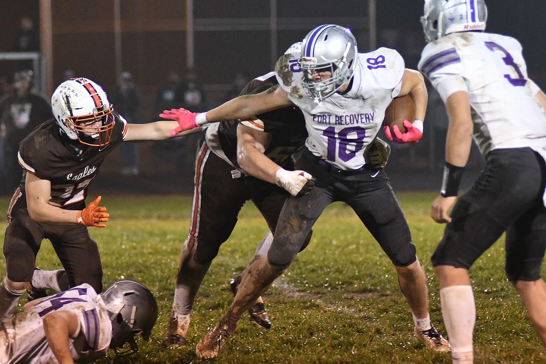 Breaker Jutte of the No. 10 Fort Recovery High School football team fights to gain some yards during the OHSAA Division VII Regional 28 quarterfinal at Eastern that the Indians won 38-6 on Friday night. Jutte scored a pair of first-quarter touchdowns before Alex Gaerke and Colson Post connected four times in the final three periods to take down the undefeated Eagles. (The Commerical Review/Andrew Balko)