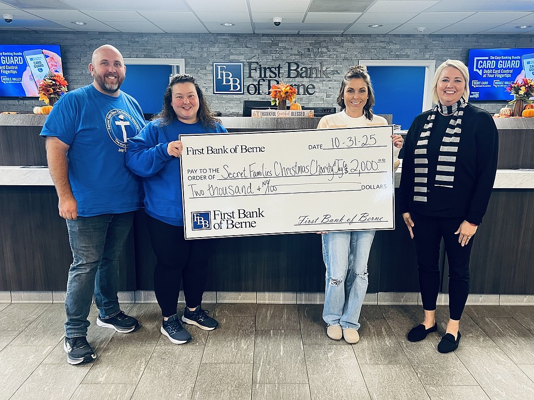 First Bank of Berne recently donated $2,000 to Secret Families Christmas Charity of Jay County. The funds will go toward the charity’s efforts to provide gifts, Christmas trees and a holiday meal to families that might otherwise go without. Pictured, from left, are Secret Families board member Don Hall, co-founder Kadie Hall and board member Amanda Foreman, accepting a check from Tracy Carpenter, Portland branch manager for First Bank of Berne. (photo provided)