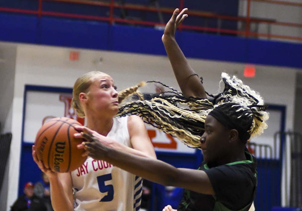 Karsyn Schwieterman of the Jay County High School girls basketball team drives to the basket during the Patriots’ 62-16 win over the Fort Wayne South Side Archers on Tuesday. Schwieterman’s 17 points in her varsity debut made her one of 10 Patriots to score in the opening-night victory. (The Commercial Review/Ethan Oskroba)