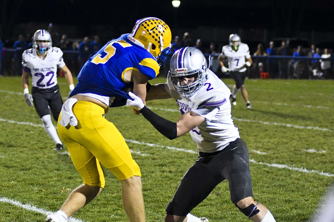 Fort Recovery High School’s Brody Barga rips Brayden Mescher out of bounds during the OHSAA Division VII Regional 28 semifinal game at Marion Local on Friday night. The Indians fell 35-0 to the undefeated Midwest Athletic Conference foe to finish the season with seven or more wins for just the fourth time in school history. (The Commercial Review/Andrew Balko)