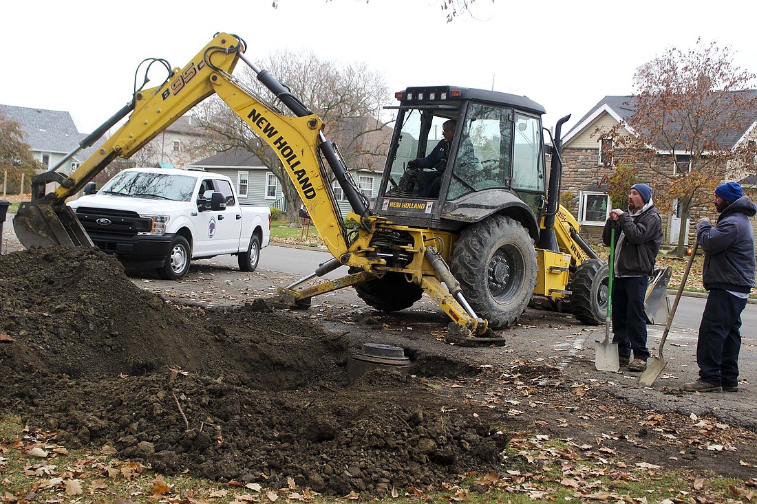 Portland Water Department employee Rich Schlechty replaces dirt over a water line access point Thursday, with coworkers Zach Bailey and Kyle Overla at Haynes Park. The department replaced the water service for the park’s restrooms this week. (The Commercial Review/Bailey Cline)