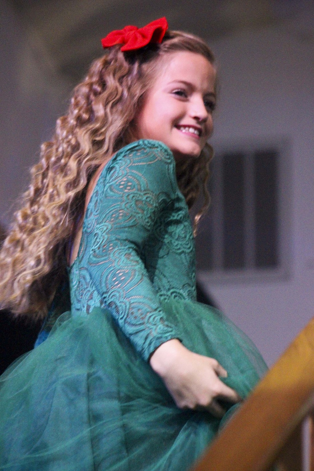 Addilyn McClain walks up some steps at Fellowship Baptist Church as she heads onto the stage during Saturday’s Little Miss Winterfest Pageant. The event was part of Jay County Chamber of Commerce’s Winterfest activities that kicked off with Christmas at the Courthouse on Friday night. (The Commercial Review/Bailey Cline)
