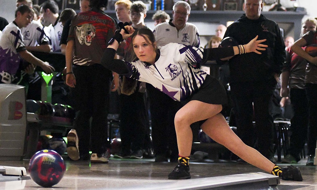 Jadyn Wyerick of the Fort Recovery High School girls bowling team follows through while rolling her Storm Tropical Surge during Saturday’s 2,284-2,093 loss to Van Wert at Plaza Lanes in Celina. Wyerick rolled the high game of the match at 211 pins en route to the third-best series of 346. (The Commercial Review/Andrew Balko)