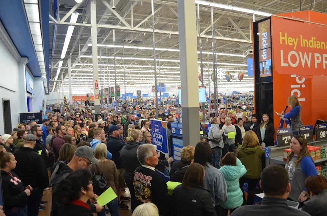 Volunteers gather at Walmart in Portland to shop for Secret Families Christmas Charity of Jay County in 2019. On Saturday, Dec. 6, the organization will hold its 10th shopping, wrapping and delivering day to ensure that families in need in Jay County are able to celebrate the holiday season. Co-founders Conny Knight and Kadie Hall said there are typically at least 150 volunteers who participate in the shopping portion of the day. They encouraged more volunteers, including local athletic teams and service groups, to get involved. “It’s a very powerful statement from your community or for someone to see when they don't think they're gonna get Christmas at all,” said Knight. (Photo provided)