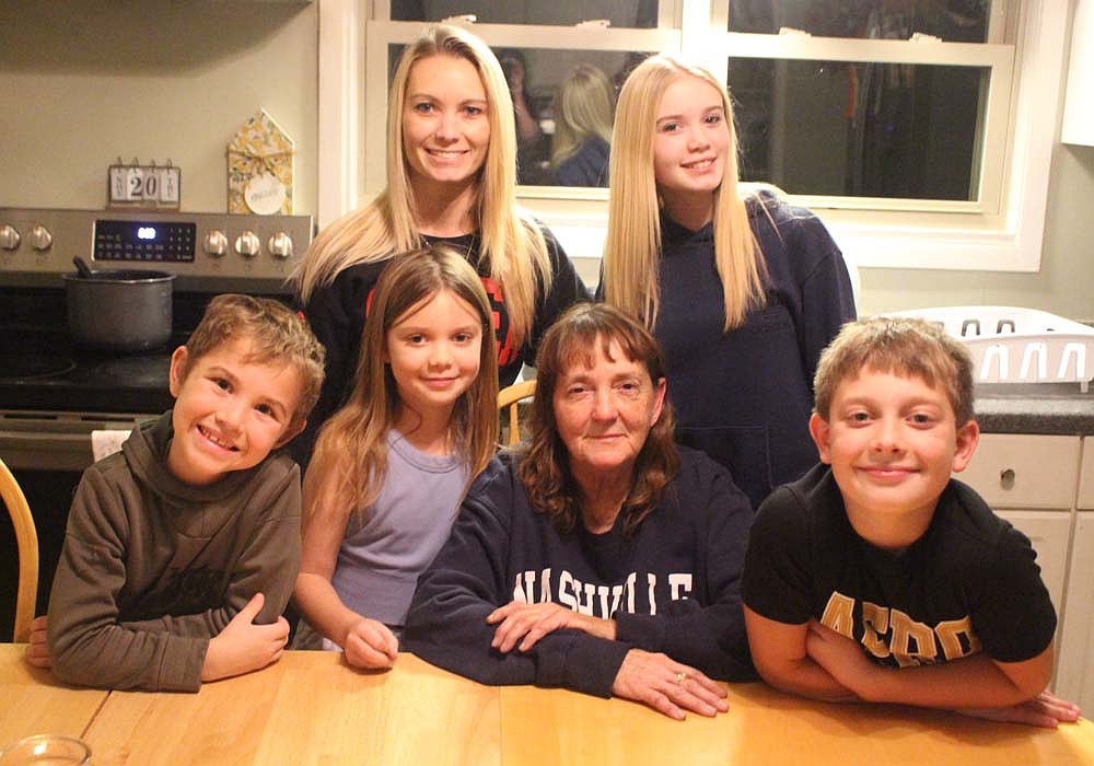 Keshia Gerber’s children rescued next-door neighbor Nina Osgood from her house fire along Adams Street in Montpelier on Nov. 1. Pictured above are, first row, are Grant Cosner, Brenna Fields, Nina Osgood and Reece Fields. In the back row are Keshia Gerber and Kailyn Fields. (The News Times/Bailey Cline)