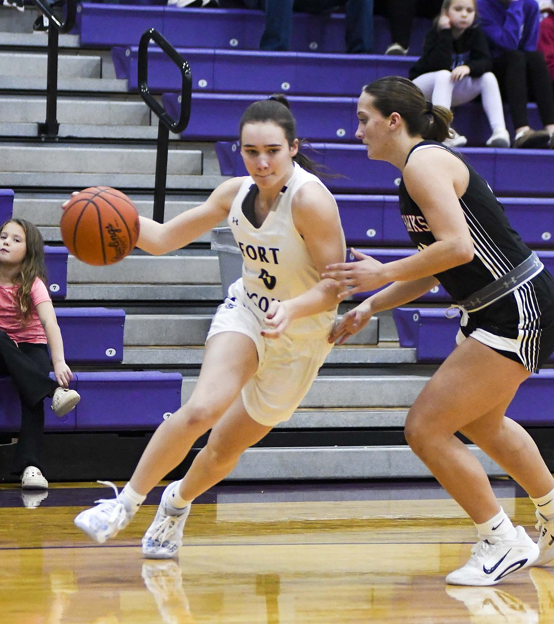 Cameron Muhlenkamp of Fort Recovery High School drives past Mississinawa Valley’s Brooklynn Seubert during the first quarter of the Indians’ 46-29 loss Friday. Muhlenkamp scored 10 points on 5-of-7 shooting, but FRHS struggled offensively overall as it shot just 27% and 1-of-20 from long distance. (The Commercial Review/Ray Cooney)