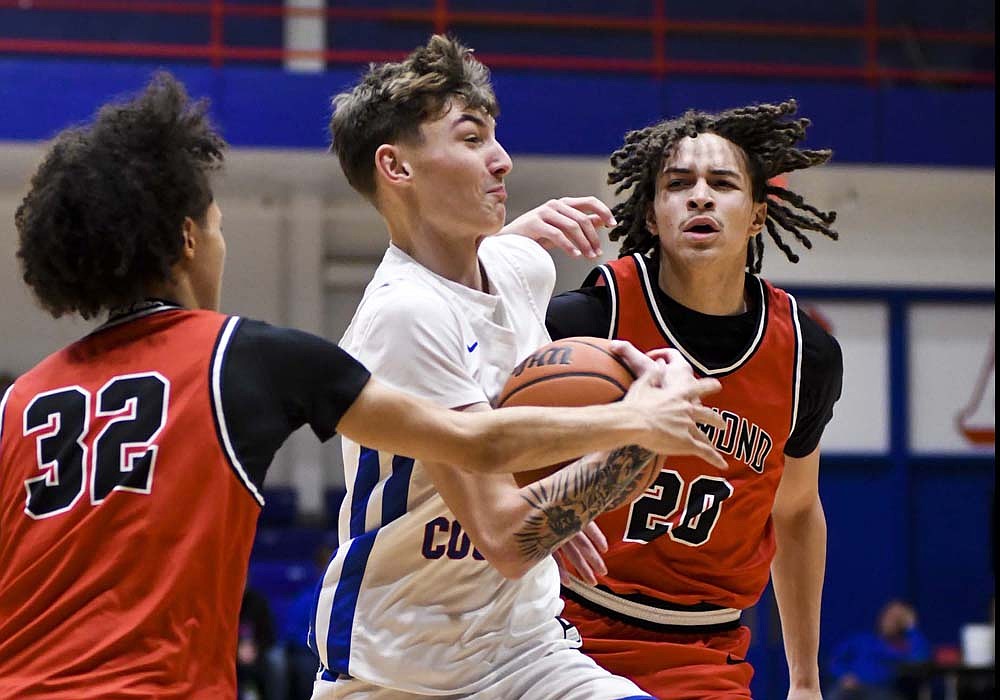 Jayden Comer of the Jay County Patriots drives the lane during Monday’s 56-53 win over Richmond. Comer scored the first seven points of the fourth quarter, assisted two more buckets and hit the final free throws to ice the game away. (The Commercial Review/Andrew Balko)