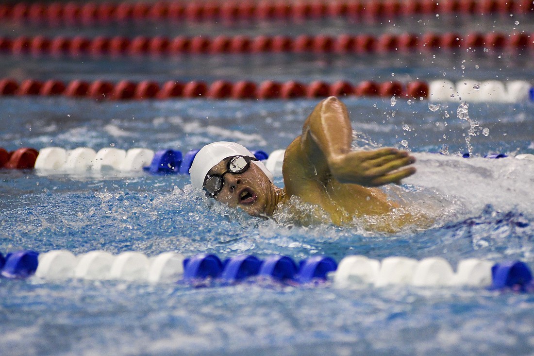 Jay County High School freshman Grant Glentzer swims the 500-yard freestyle during the boys swim team’s 190-109 loss to Bluffton on Wednesday. Glentzer placed third in both the 500 freestyle and 200 individual medley to help support the efforts of fellow freshman Grady Warvel, who earned victories in the 200 IM and 100 butterfly. (The Commercial Review/Andrew Balko)