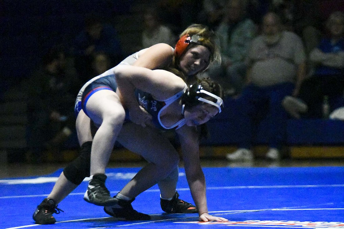 Jay County High School’s Kaylee Bramlett works to keep control of Savana Scott of the No. 10 Hamilton Southeastern Royals during Thursday’s 42-36 loss. While the Patriots suffered the narrow victory to the ranked Royals, they bounced back to beat Hagerstown 48-30 in the following match. (The Commercial Review/Ethan Oskroba)