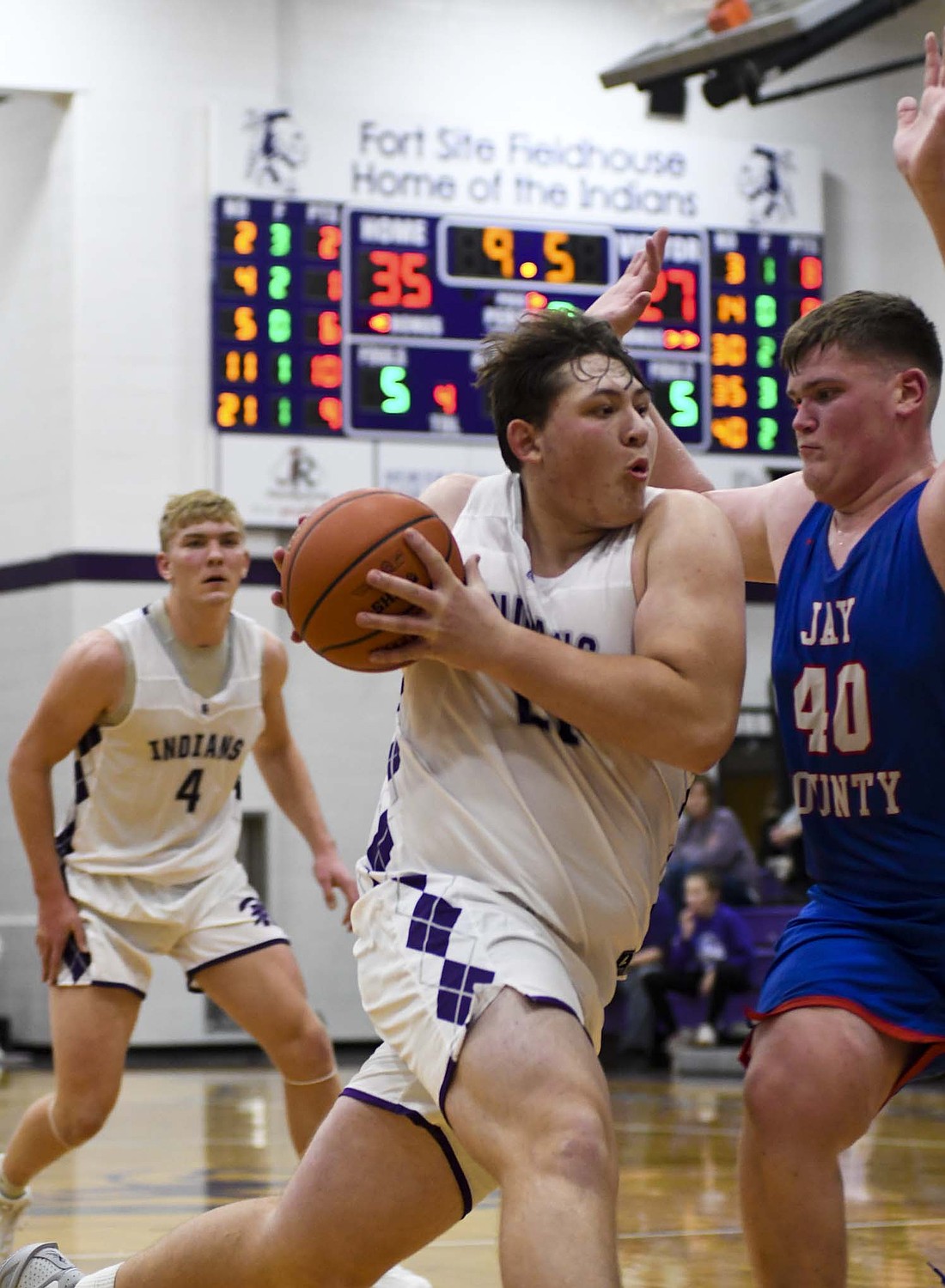 Hudson Overman drives to the basket during the Fort Recovery High School basketball team’s 49-40 win over the Jay County Patriots on Saturday. Overman’s team-high 15 points helped make up for a slow night from Breaker Jutte and Brody Barga, who combined for just nine points after totaling 35 the Indians’ season opener. (The Commercial Review/Andrew Balko)