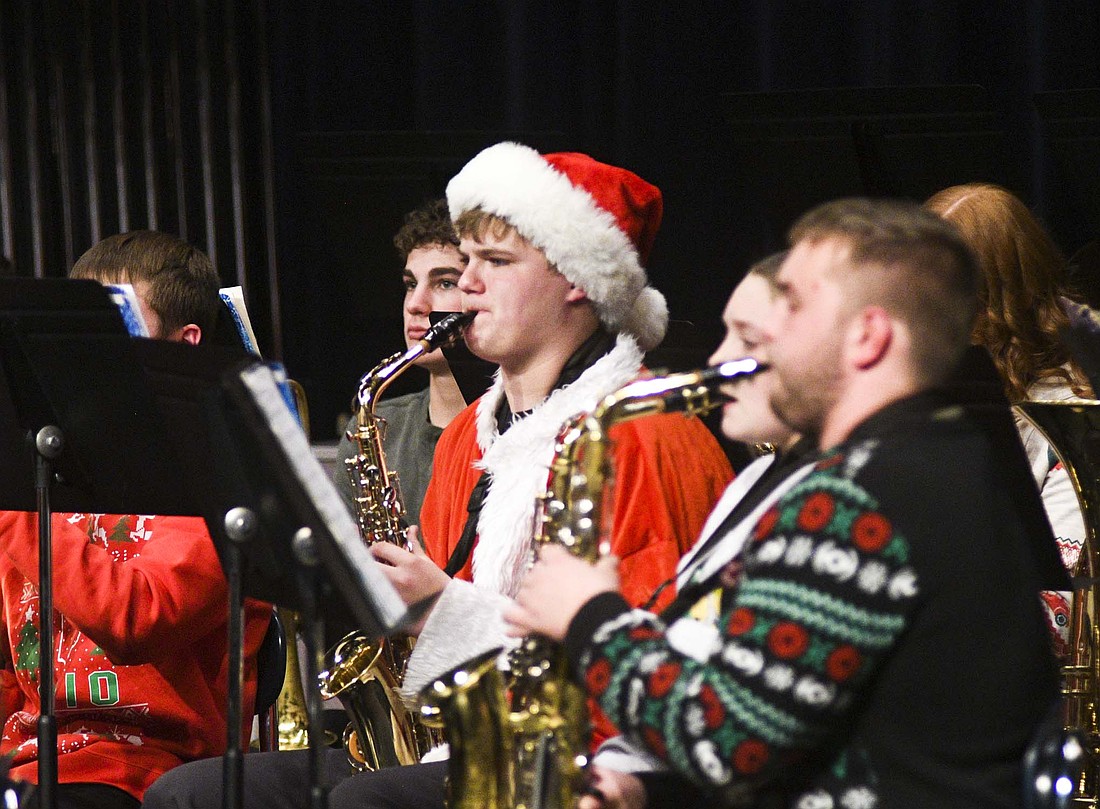 Members of the Fort Recovery High School band’s saxophone section are adorned in Christmas attire during their performance Sunday evening. (The Commercial Review/Ray Cooney)