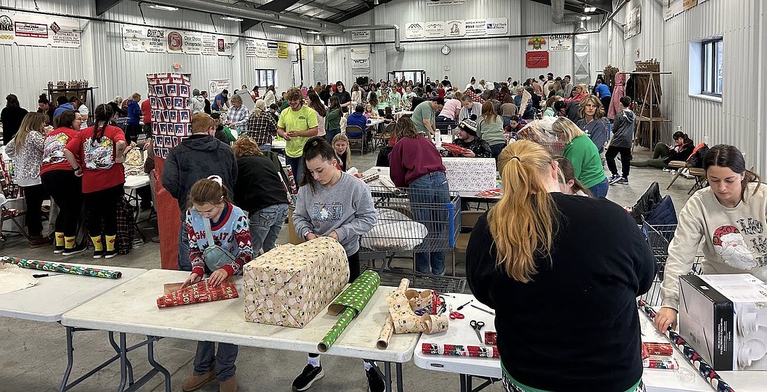 Volunteers gathered to wrap gifts Saturday in the Bubp Building at Jay County Fairgrounds for Secret Families Christmas Charity of Jay County. The organization held its 10th event, purchasing, wrapping and delivering gifts to about 150 families. (photo provided)